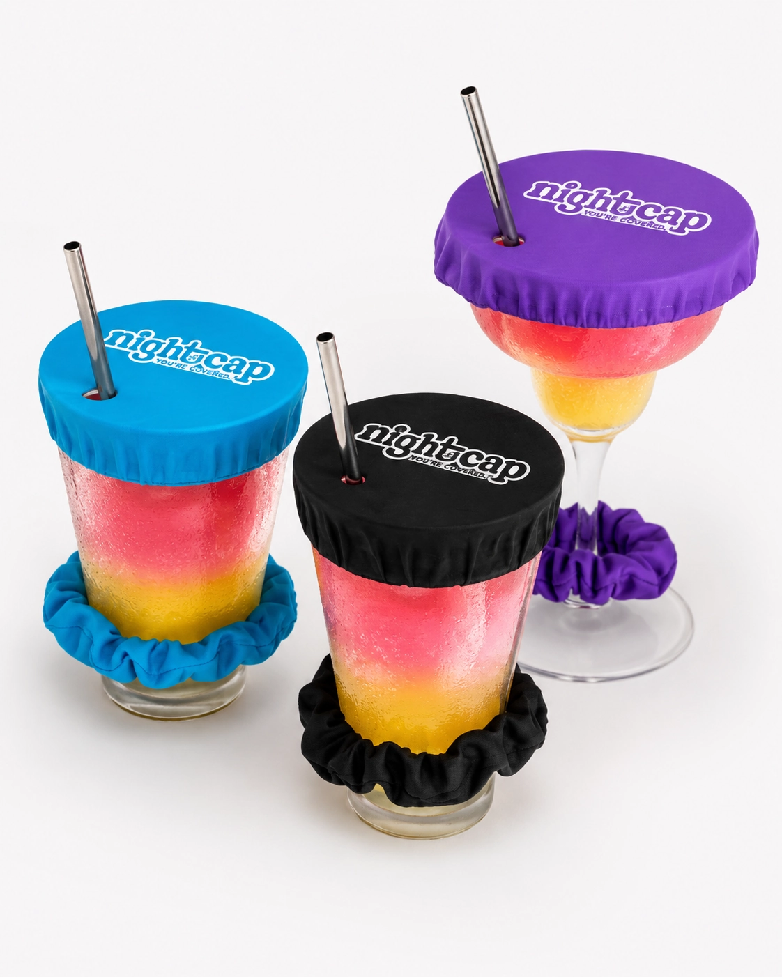 NightCap-style drink covers in multiple colors stretched over cups with straws.